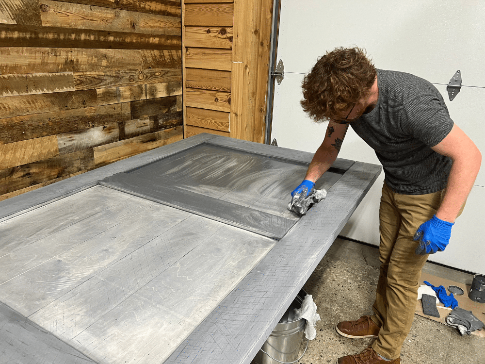 staining a reclaimed barn wood door in step 3